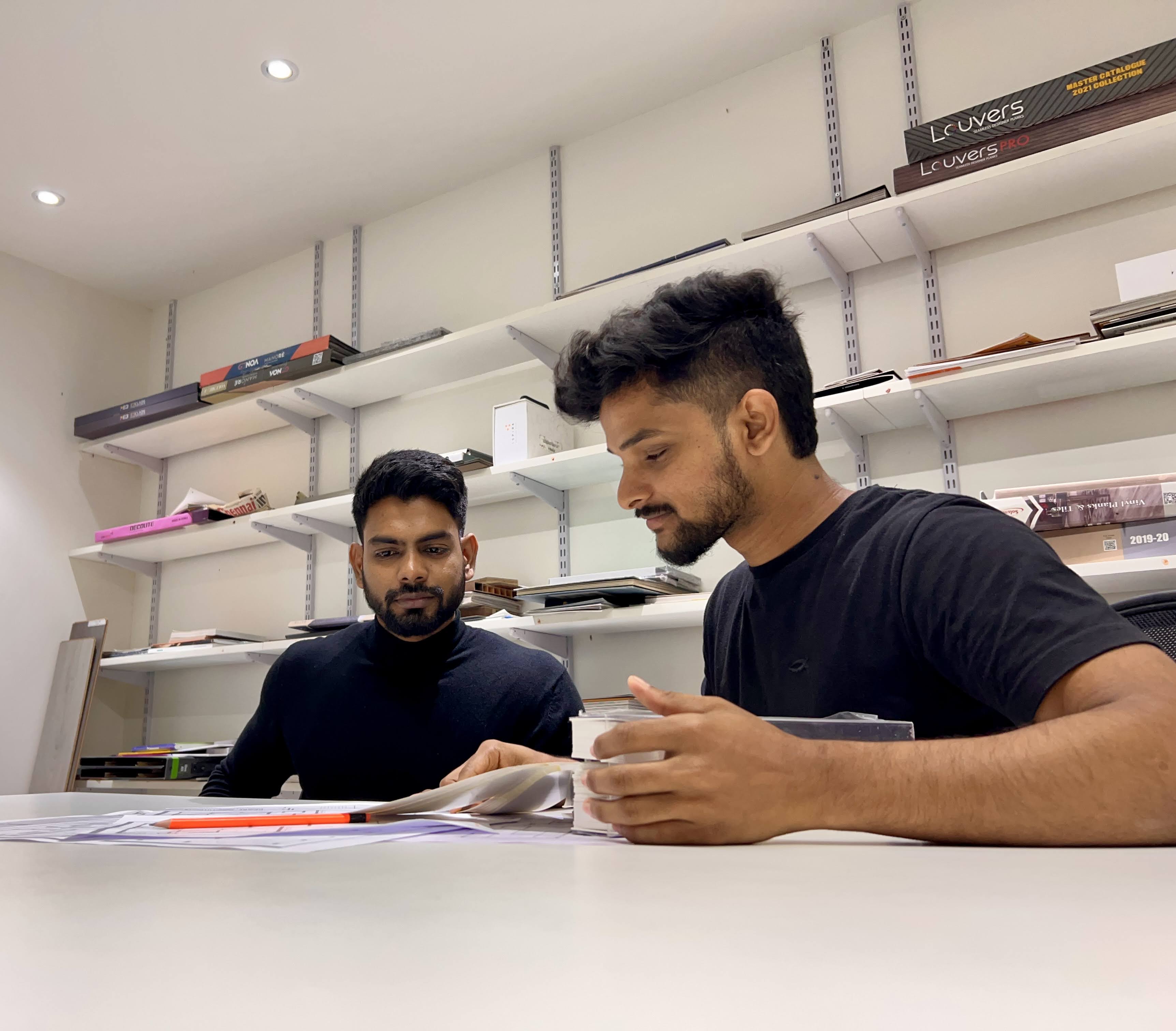 Team reviewing floor plans